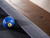 Close-up view of the billiard sights on the Nora Slate Pool Table in Brown Wash. The table features brushed metal sights for precision and durability, perfectly complementing the farmhouse-inspired solid wood frame. Designed for accuracy and style, this table is built to provide both professional-level gameplay and rustic elegance. Available at Sawyer Twain with optional dining top and matching accessories.