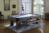 A lifestyle scene showing the integrated pull-out storage drawer in use, filled with cues, balls, and triangle—demonstrating the table’s smart, space-saving design.