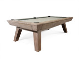 Three-quarter lifestyle view of the Nixon Desyn Pool Table in Antique finish, styled in a rustic contemporary interior with warm textures and industrial accents. Highlights the clean leg design, rich finish, and how seamlessly the table integrates into a thoughtfully designed space. Three-quarter lifestyle view of the Nixon Desyn Pool Table in Antique finish, styled in a rustic contemporary interior with warm textures and industrial accents. Highlights the clean leg design, rich finish, and how seamlessly the table integrates into a thoughtfully designed space.