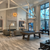 Isaac Slate Pool Table in Silvered Ash featured in a professionally styled modern living space. The soft wood tones and industrial accents make this a centerpiece for elevated home entertainment.